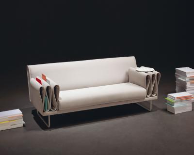 tri-folds sofa by camille paillard uses arm rest for storage