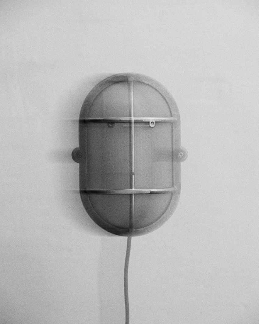 philippe tabet reimagines industrial bulkhead lamp as face-like lighting fixture