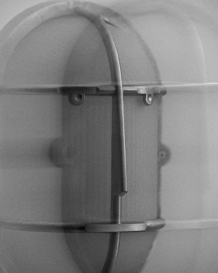 philippe tabet reimagines industrial bulkhead lamp as face-like lighting fixture