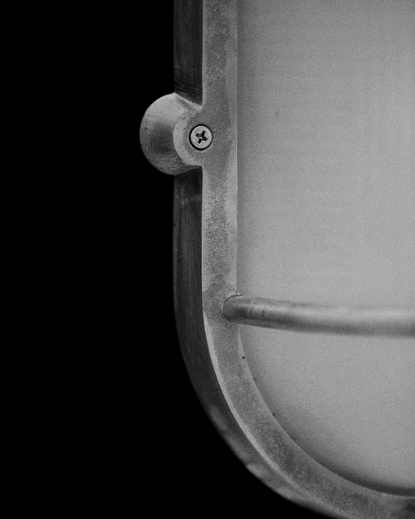 philippe tabet reimagines industrial bulkhead lamp as face-like lighting fixture