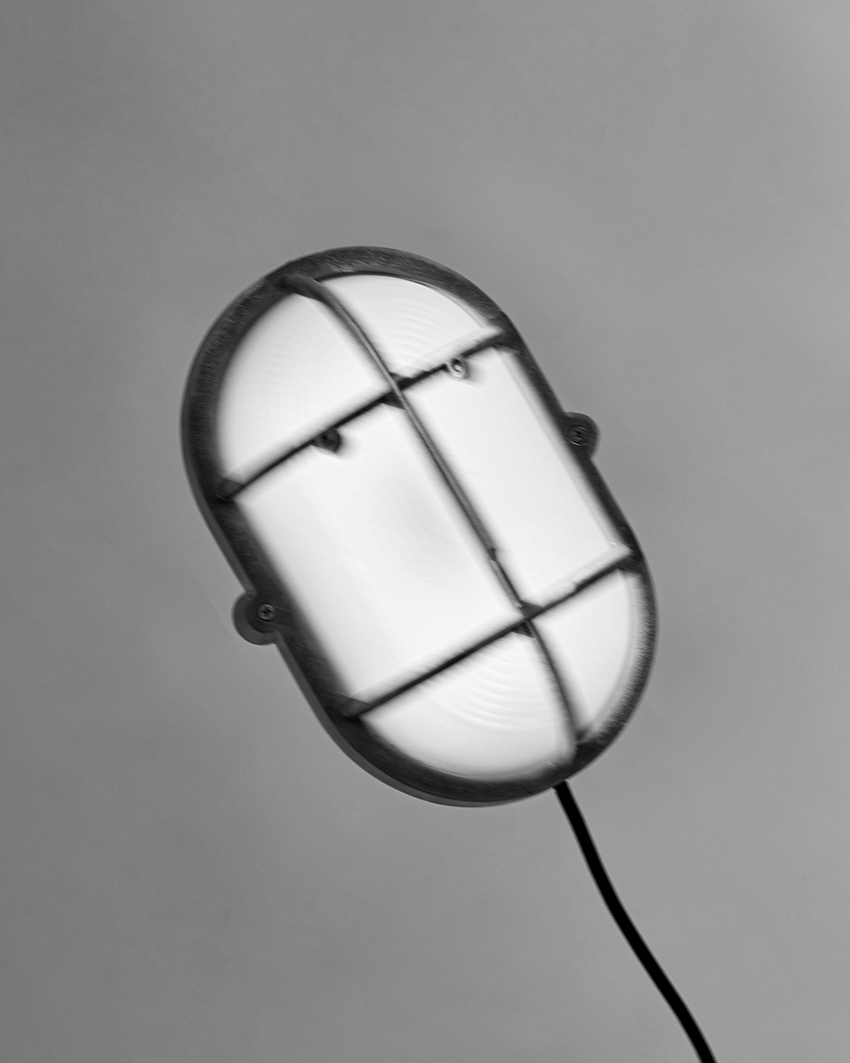 philippe tabet reimagines industrial bulkhead lamp as face-like lighting fixture