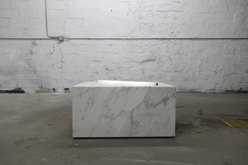 marble with fluorescent tube by castor design studio