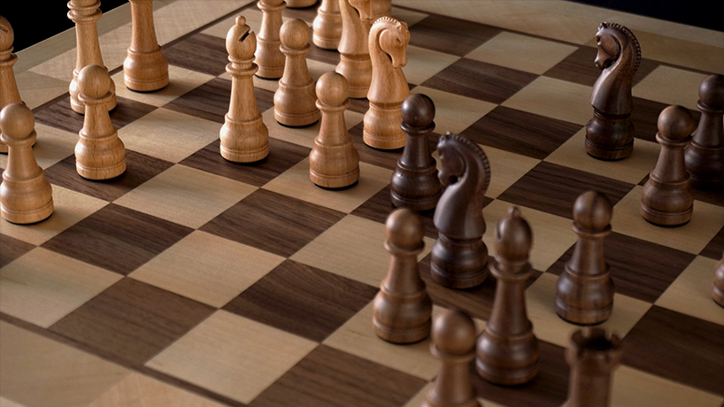 crafted in solid walnut and maple, phantom is the world&rsquo;s first robotic chessboard