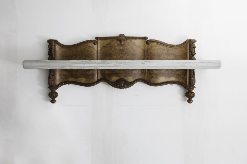 studio nucleo melds dramatic concrete blocks with antique furniture