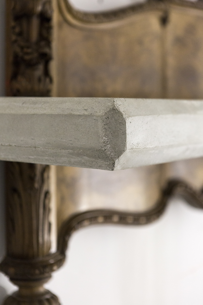 studio nucleo melds dramatic concrete blocks with antique furniture