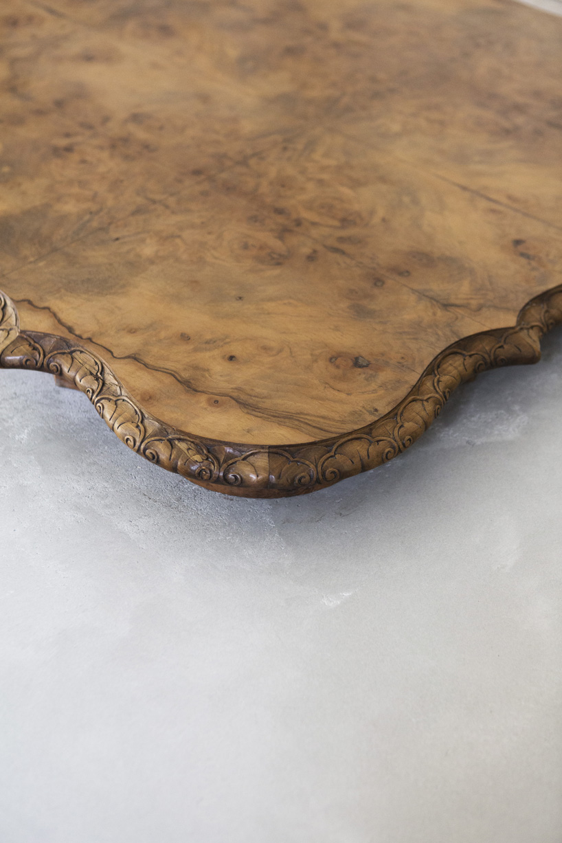 studio nucleo melds dramatic concrete blocks with antique furniture