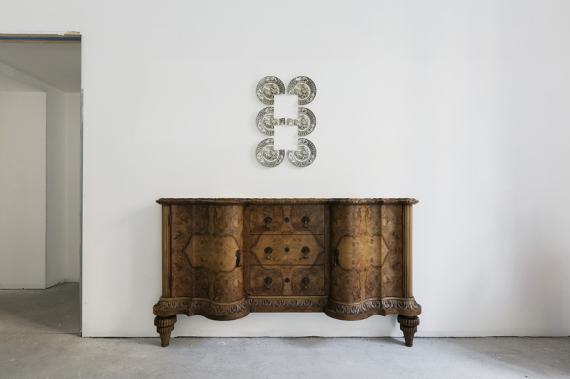 studio nucleo melds dramatic concrete blocks with antique furniture