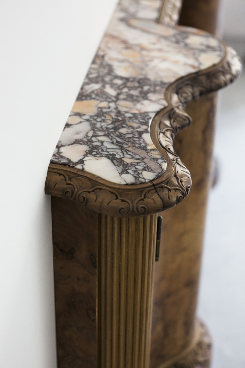 studio nucleo melds dramatic concrete blocks with antique furniture