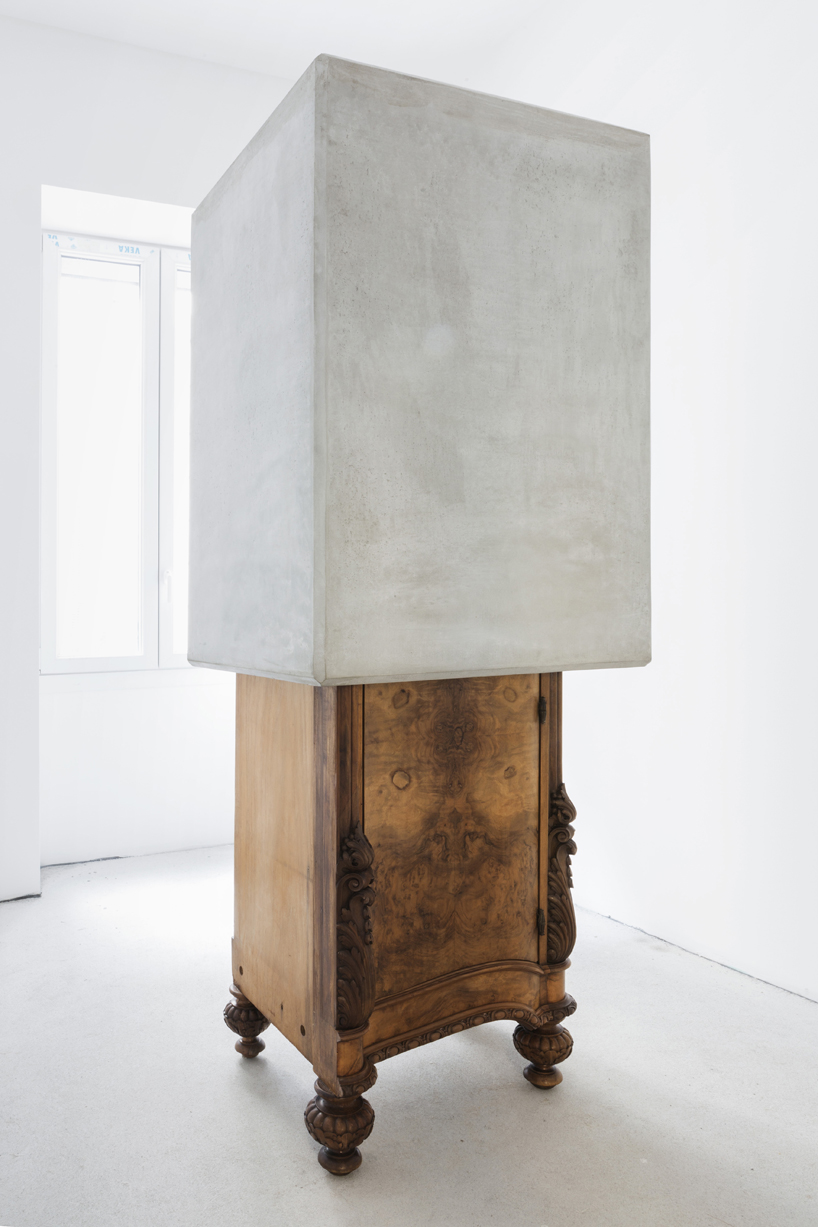 studio nucleo melds dramatic concrete blocks with antique furniture