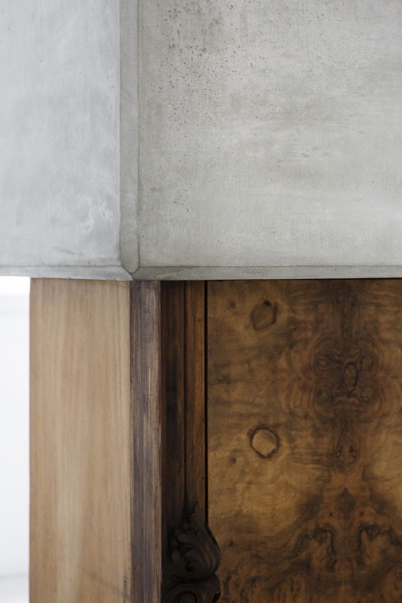 studio nucleo melds dramatic concrete blocks with antique furniture
