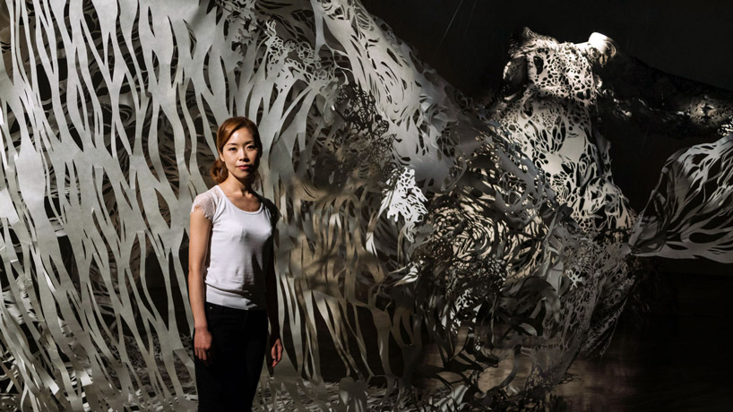 nahoko kojima cuts out an actual size whale 'shiro' from washi paper