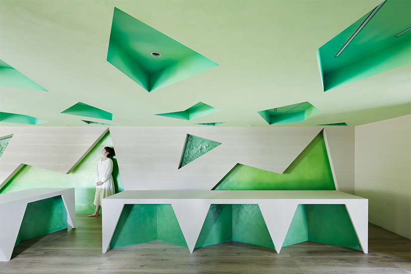 polygonal green cutouts animate kakushin tokyo office's interiors by moriyuki ochiai