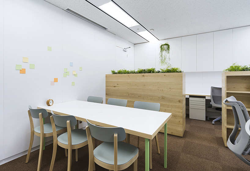 naoya matsumoto inserts soothing plants into koshida clinic in osaka