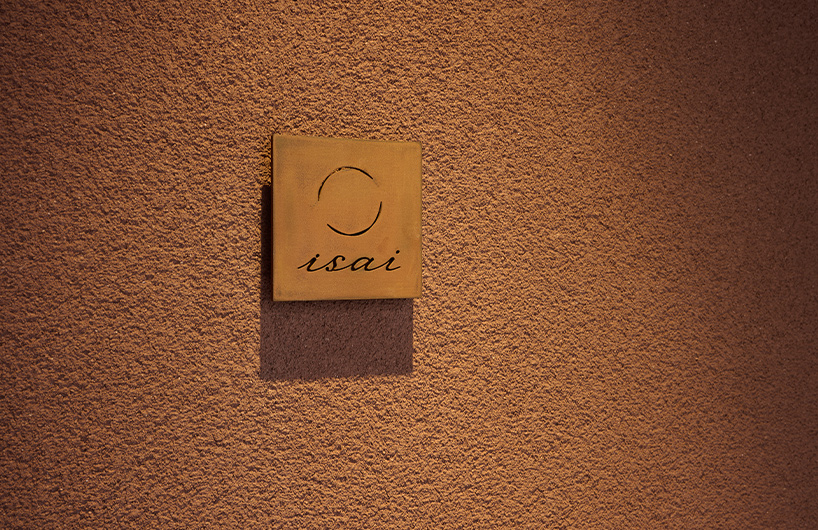 naoya matsumoto imbues earthy tones into the interior of isai restaurant in osaka