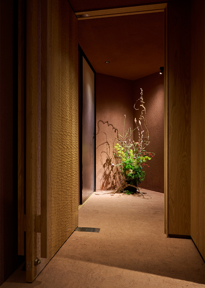 naoya matsumoto imbues earthy tones into the interior of isai restaurant in osaka