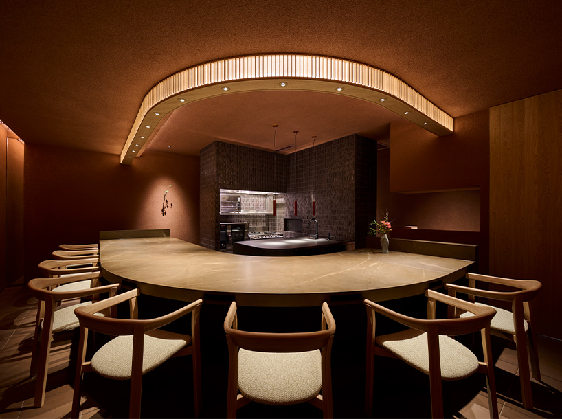naoya matsumoto imbues earthy tones into the interior of isai restaurant in osaka