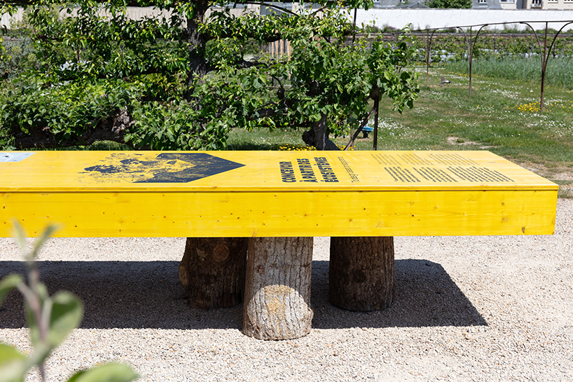 studio 5•5 stretches linear table through versailles' gardens as open dialogue on climate