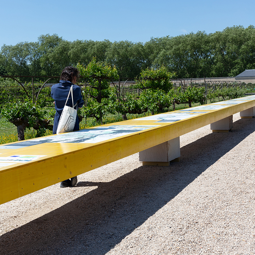 studio 5•5 stretches linear table through versailles' gardens as open dialogue on climate