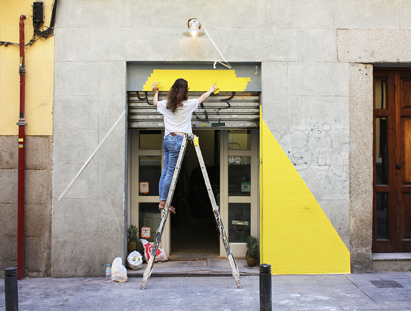 (fos) paints light onto a grey street