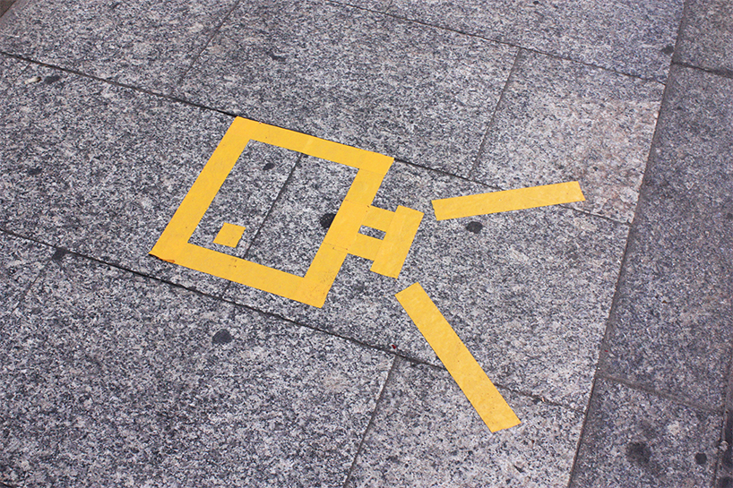 (fos) paints light onto a grey street