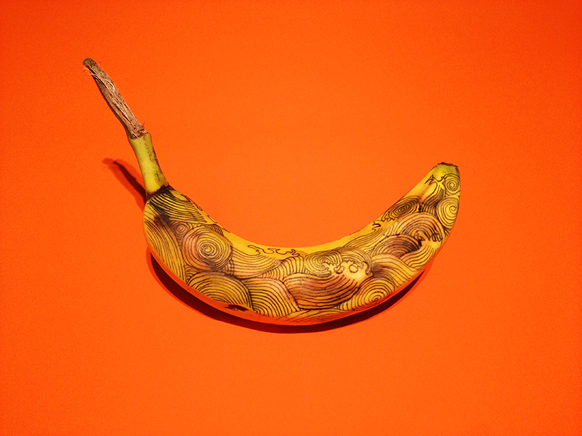 marta grossi inscribes onto temporary canvas for banana graffiti 