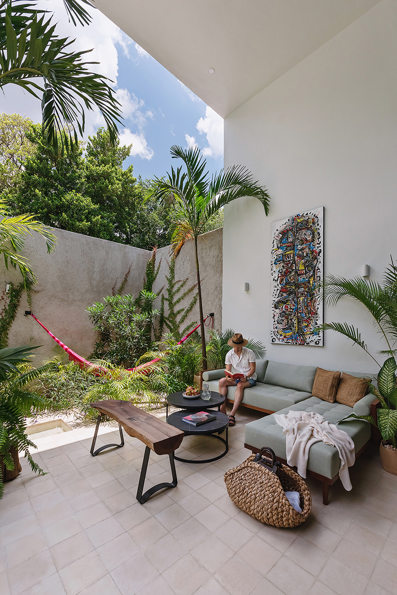 stone lattice facade clads tropical vacation house by workshop in mexico