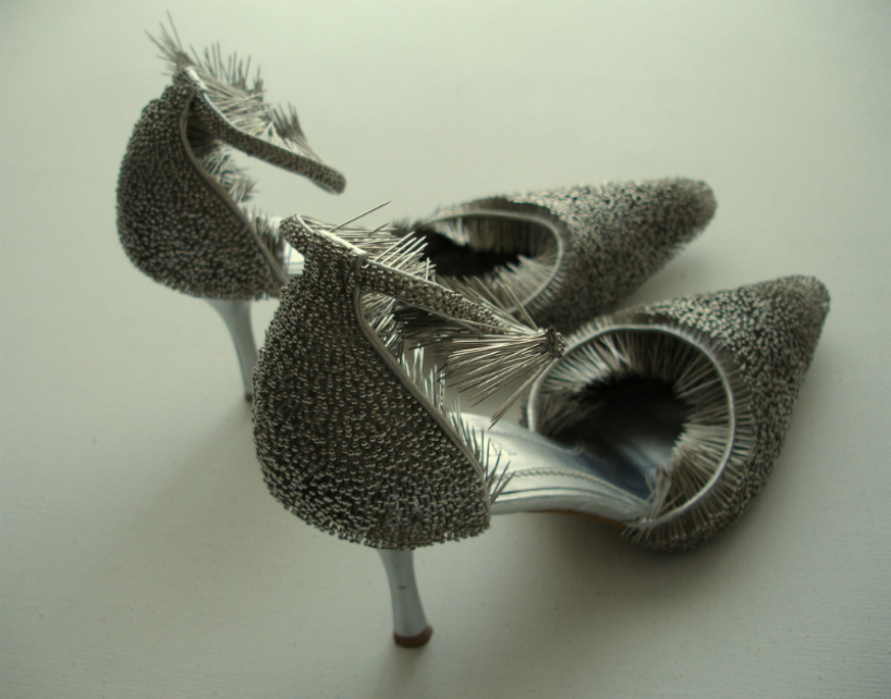 erwina ziomkowska pinches wardrobe garments with spiky pins