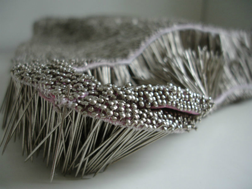 erwina ziomkowska pinches wardrobe garments with spiky pins