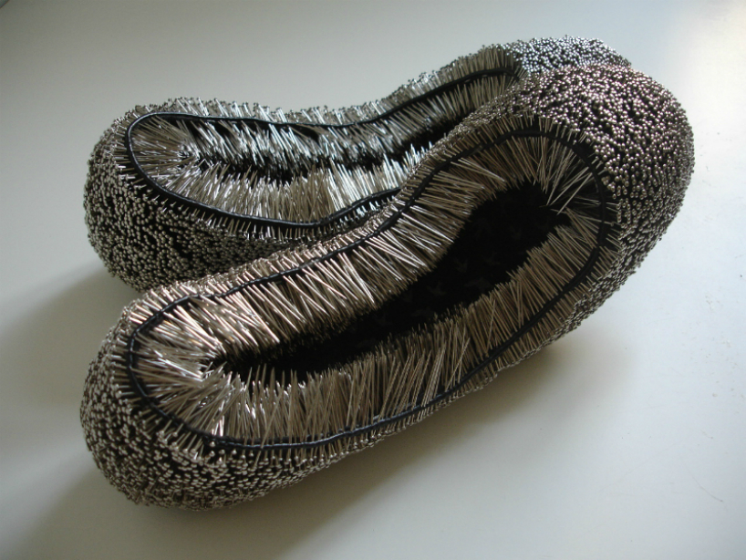 erwina ziomkowska pinches wardrobe garments with spiky pins