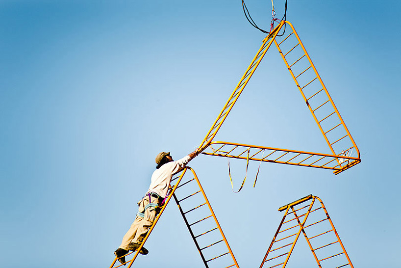 SpY urban art pyramid is constructed from safety barriers