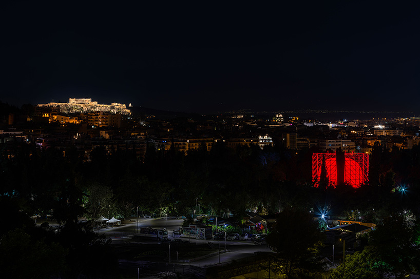 An international spy artist installs a huge work of luminous art as part of the molded exhibition in Athens 1
