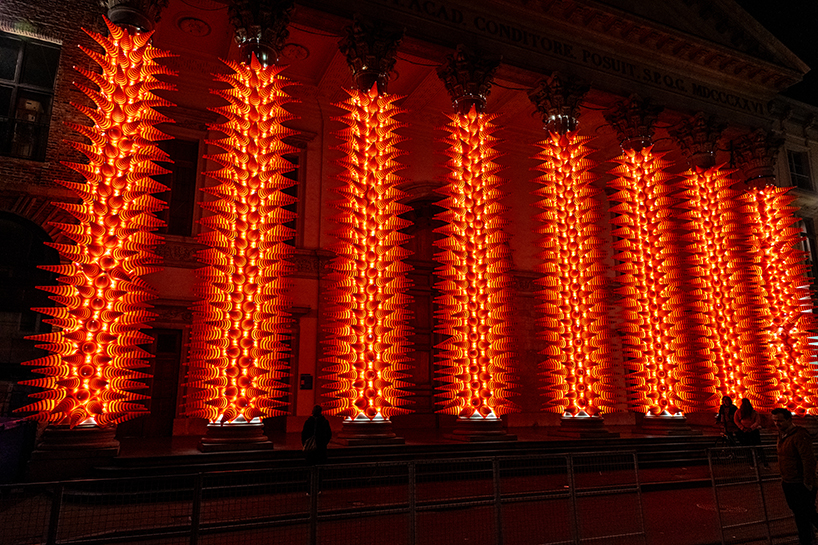 SpY wraps neoclassical columns in ghent with 1984 luminous traffic cones for lichtfestival