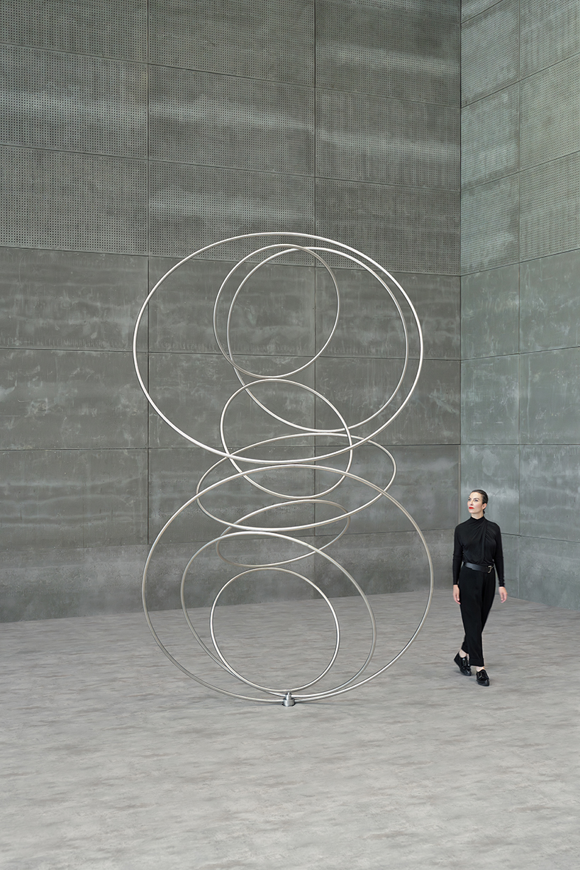 nine steel rings continuously rotate in cycles for SpY's form-bending kinetic sculpture