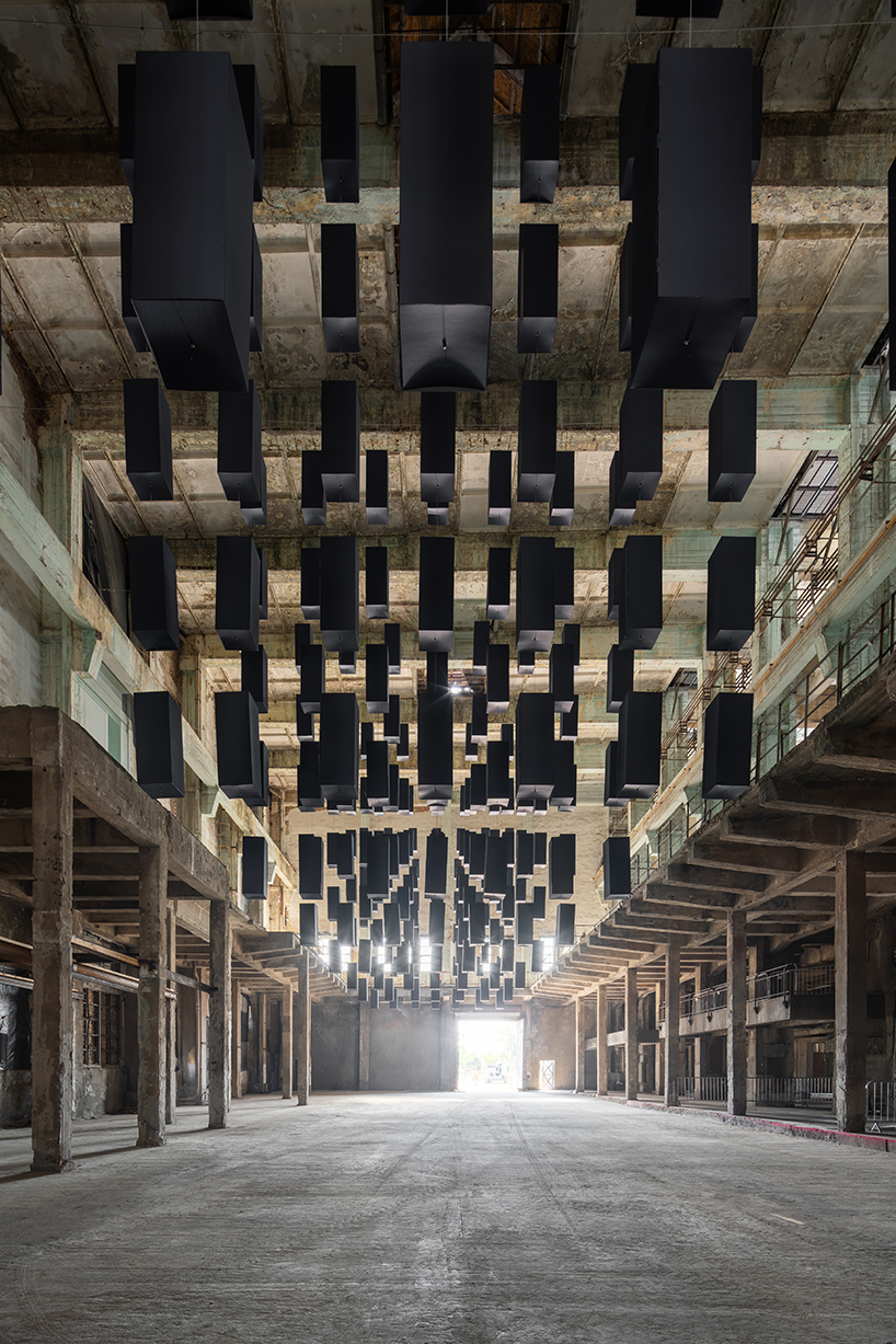 SpY's suspended grid installation of black rectangles floats within turbine factory in hungary