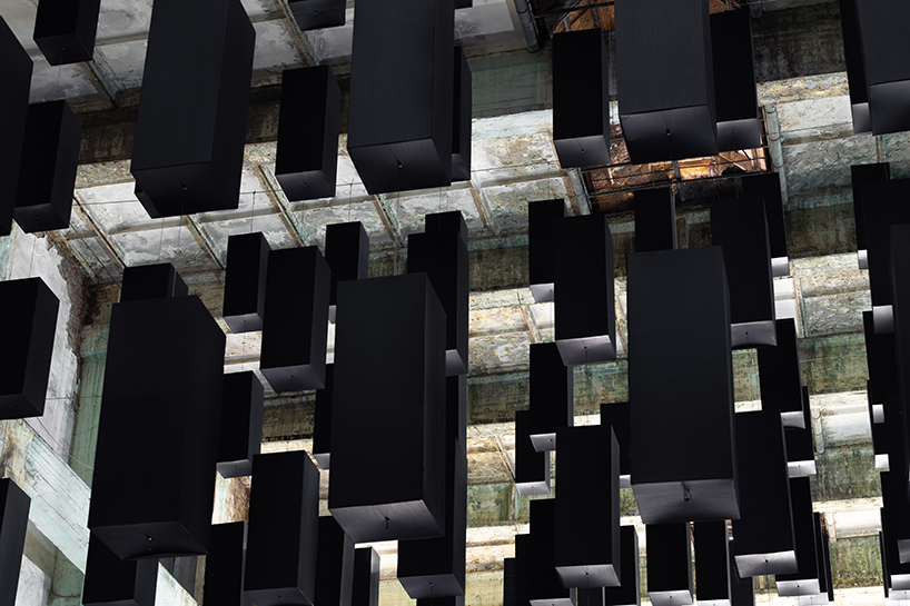 SpY's suspended grid installation of black rectangles floats within turbine factory in hungary