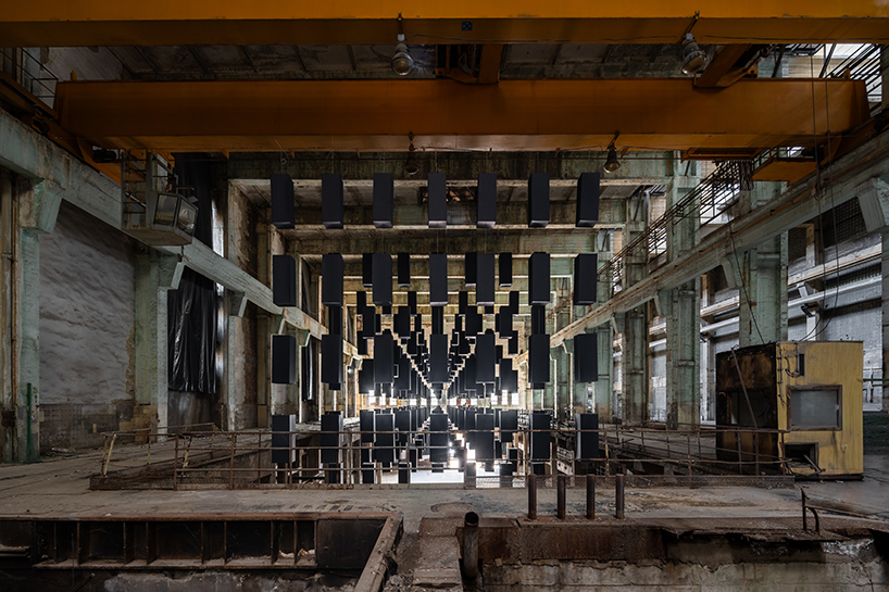 SpY's suspended grid installation of black rectangles floats within turbine factory in hungary