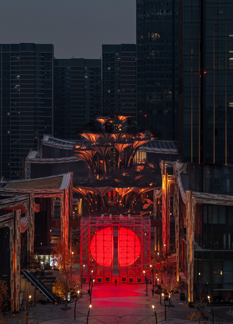 SpY's monumental divided sphere installation illuminates xi&rsquo;an in bright red light
