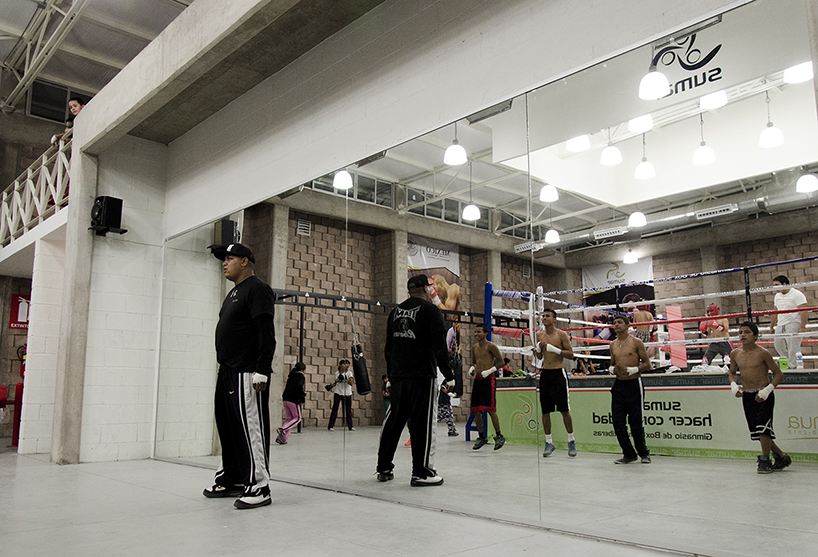 urbanika utlizes rough brick pattern for community boxing gym