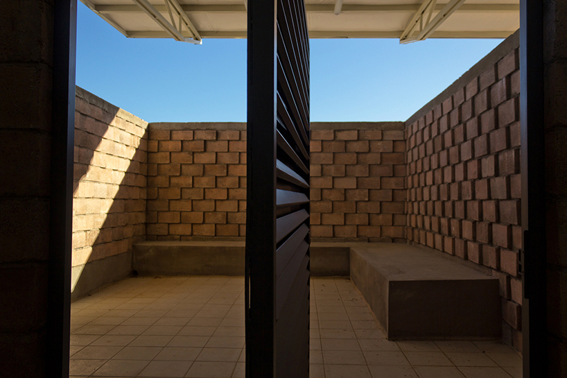 urbanika utlizes rough brick pattern for community boxing gym