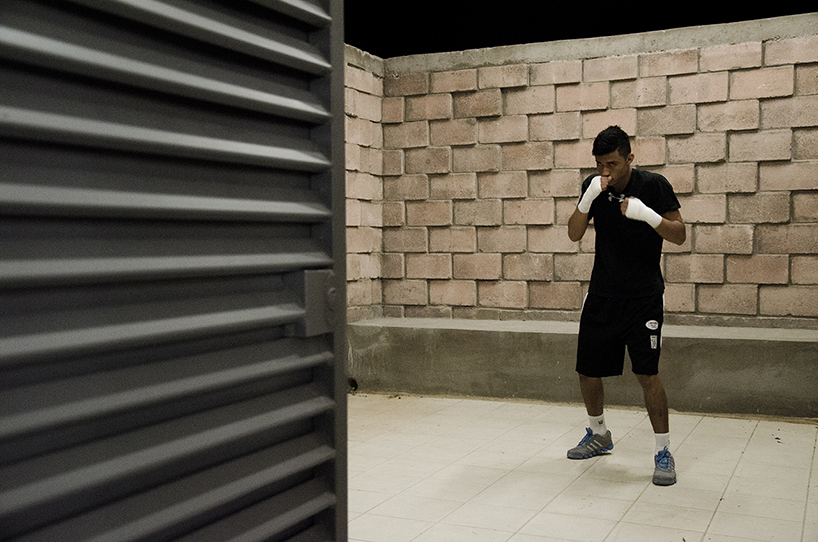 urbanika utlizes rough brick pattern for community boxing gym