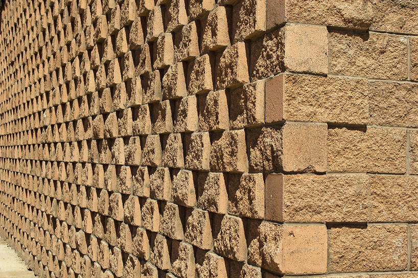 urbanika utlizes rough brick pattern for community boxing gym