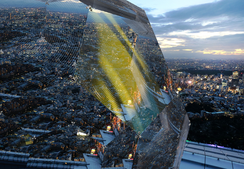 vincent leroy's geodesic 'illusion lens' installation lands on a tokyo rooftop designboom