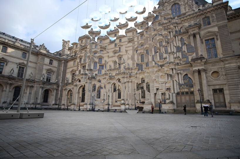 vincent leroy envisions distorting lens installation in front of the louvre