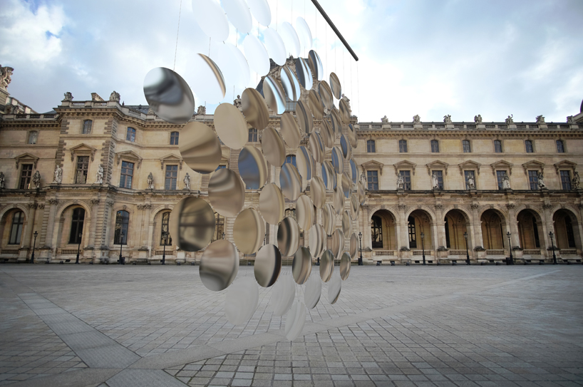 vincent leroy envisions distorting lens installation in front of the louvre