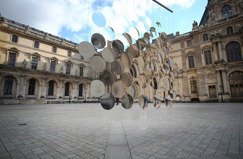 vincent leroy envisions distorting lens installation in front of the louvre