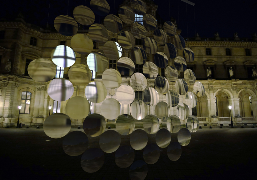 vincent leroy envisions distorting lens installation in front of the louvre