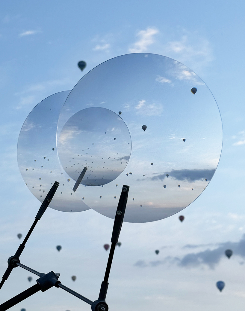 vincent leroy's optical mobile of floating lenses dances with hot air balloons over cappadocia
