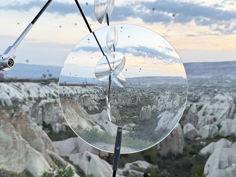 vincent leroy's optical mobile of floating lenses dances with hot air balloons over cappadocia