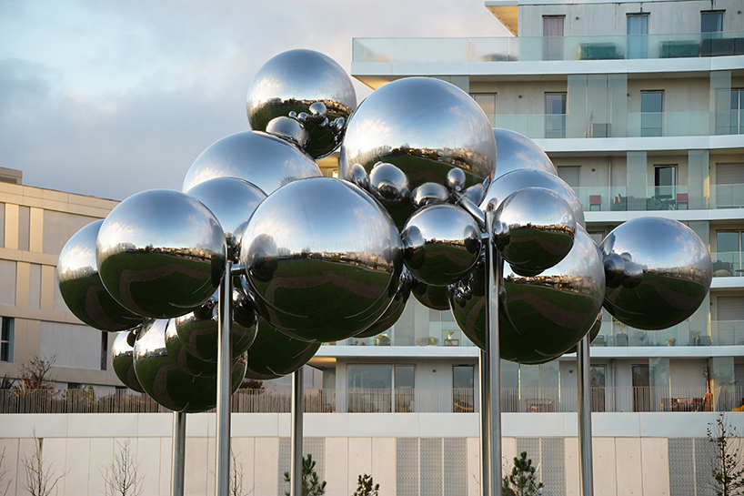 mirrored steel bubbles shape suspended kinetic sculpture by vincent leroy in normandy