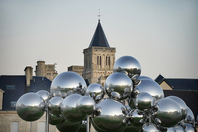 mirrored steel bubbles shape suspended kinetic sculpture by vincent leroy in normandy